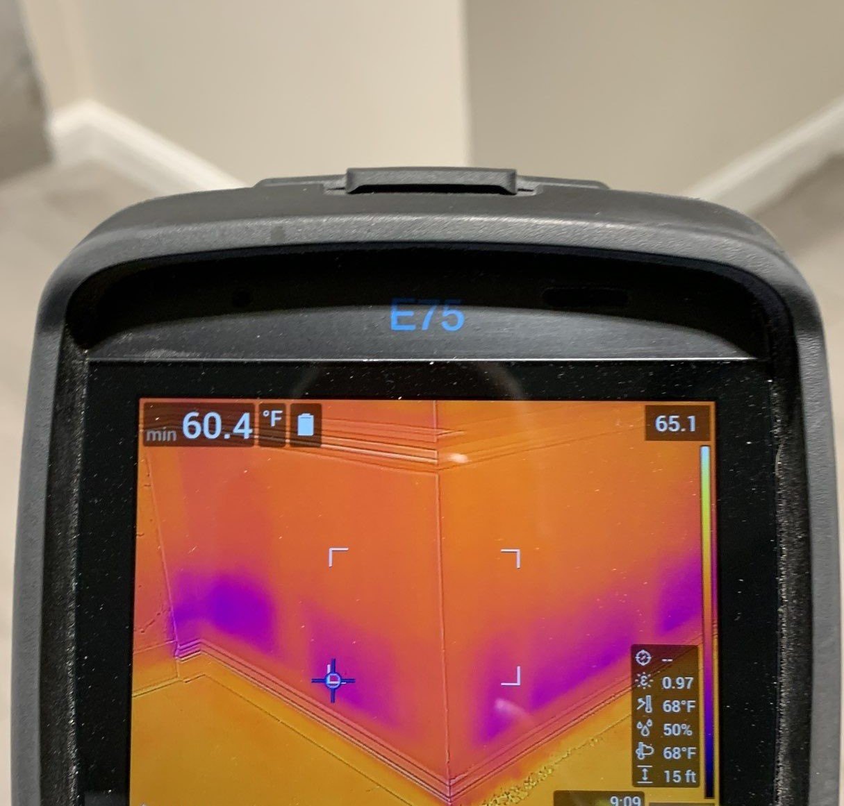 FLIR E75 thermal camera showing hidden moisture in a wall during a mold inspection